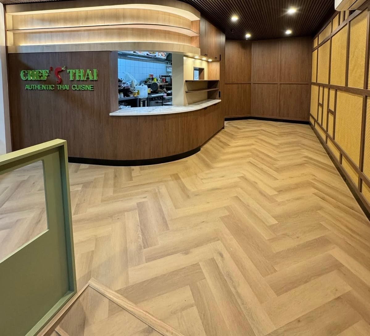 Golden oak herringbone hybrid flooring installed in Thai restaurant Melbourne