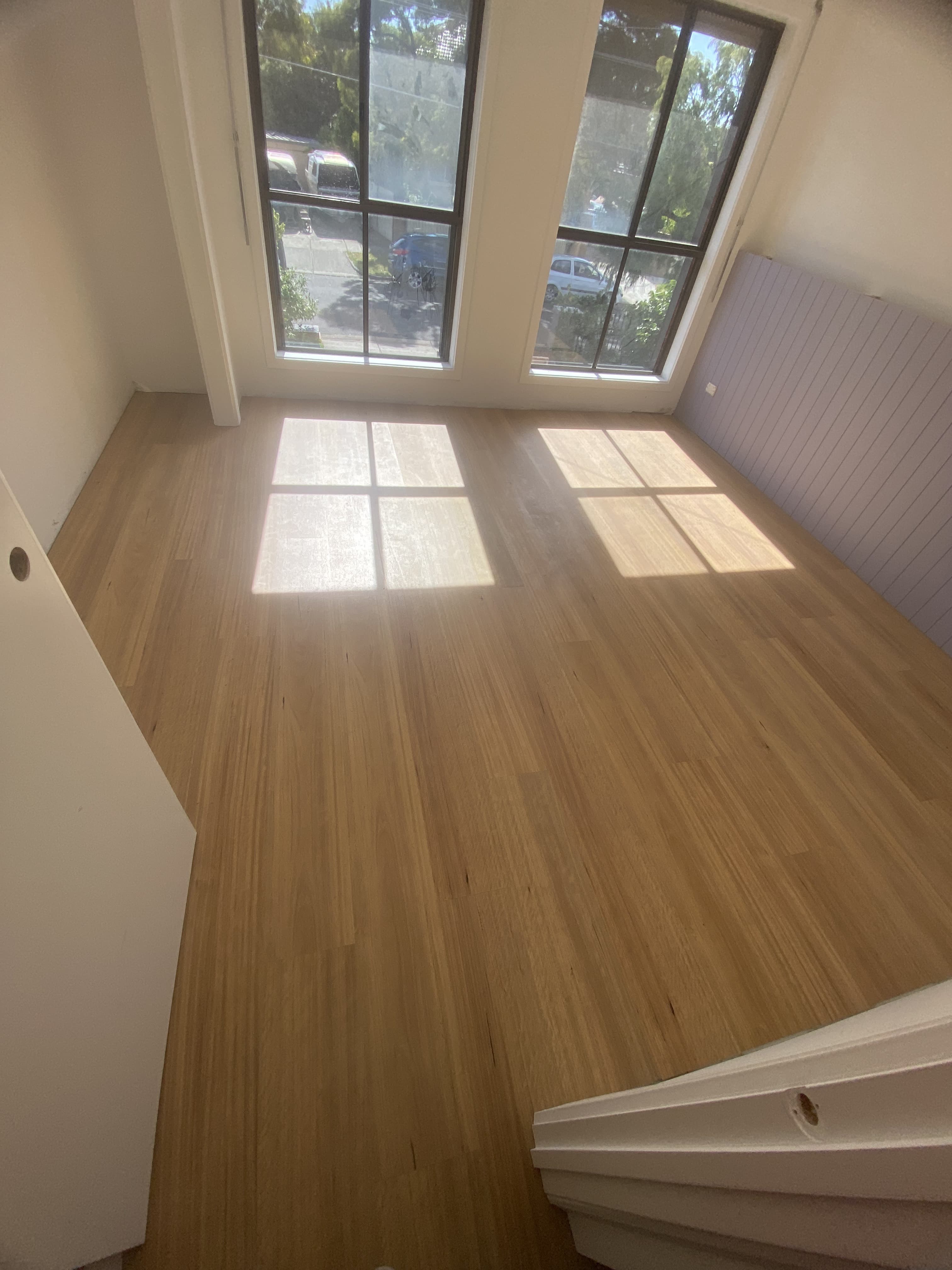 Natural oak hybrid plank flooring bright bedroom Melbourne