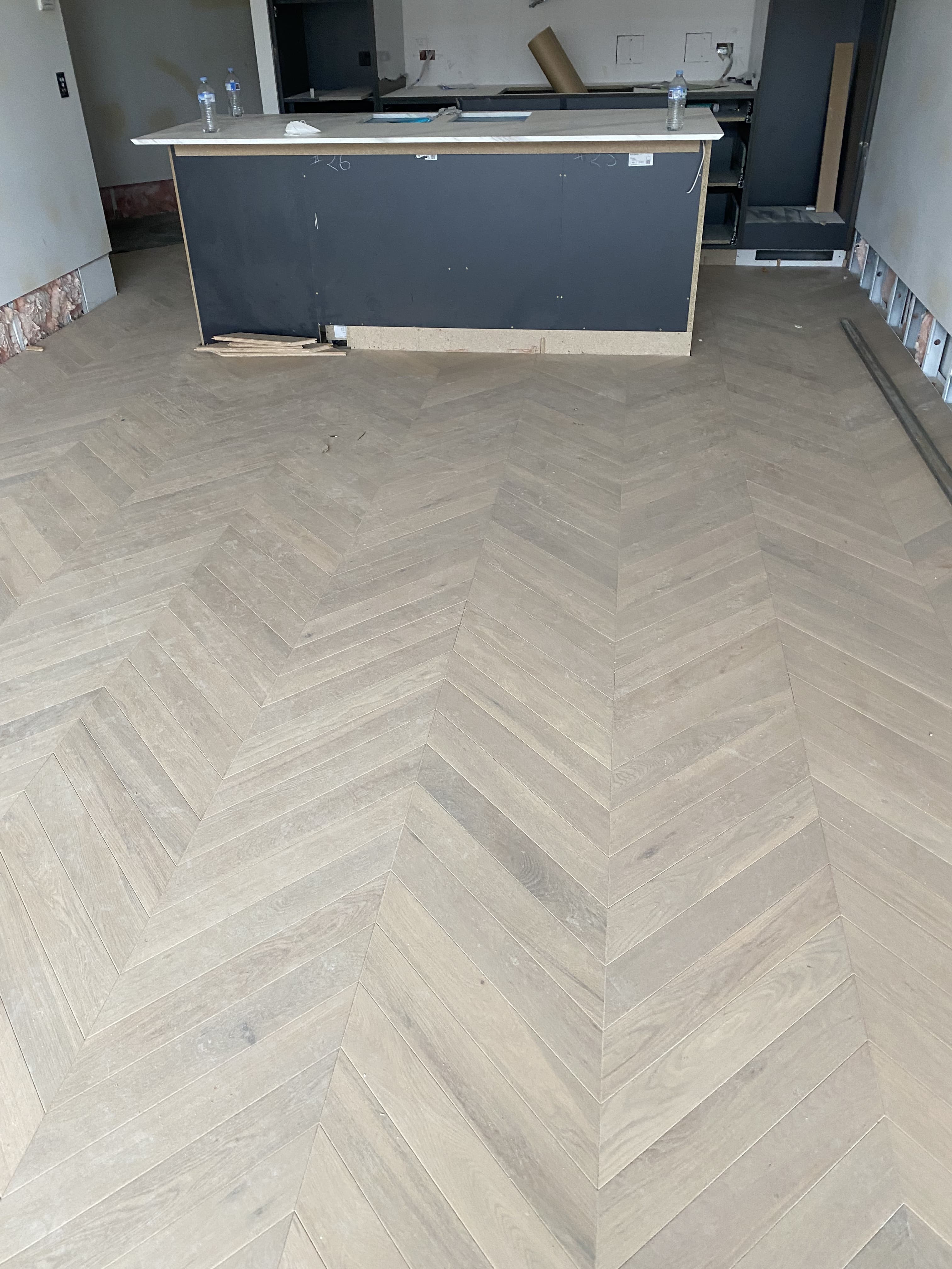 Light herringbone hybrid flooring commercial fitout Melbourne