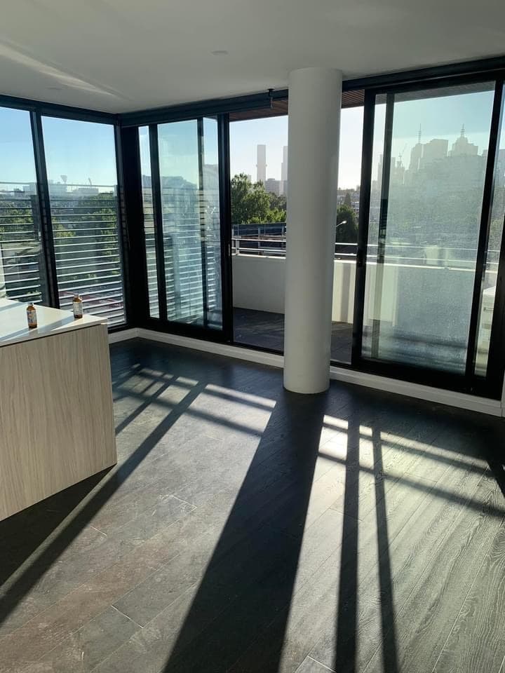 Dark smoked walnut hybrid flooring Melbourne CBD high-rise apartment