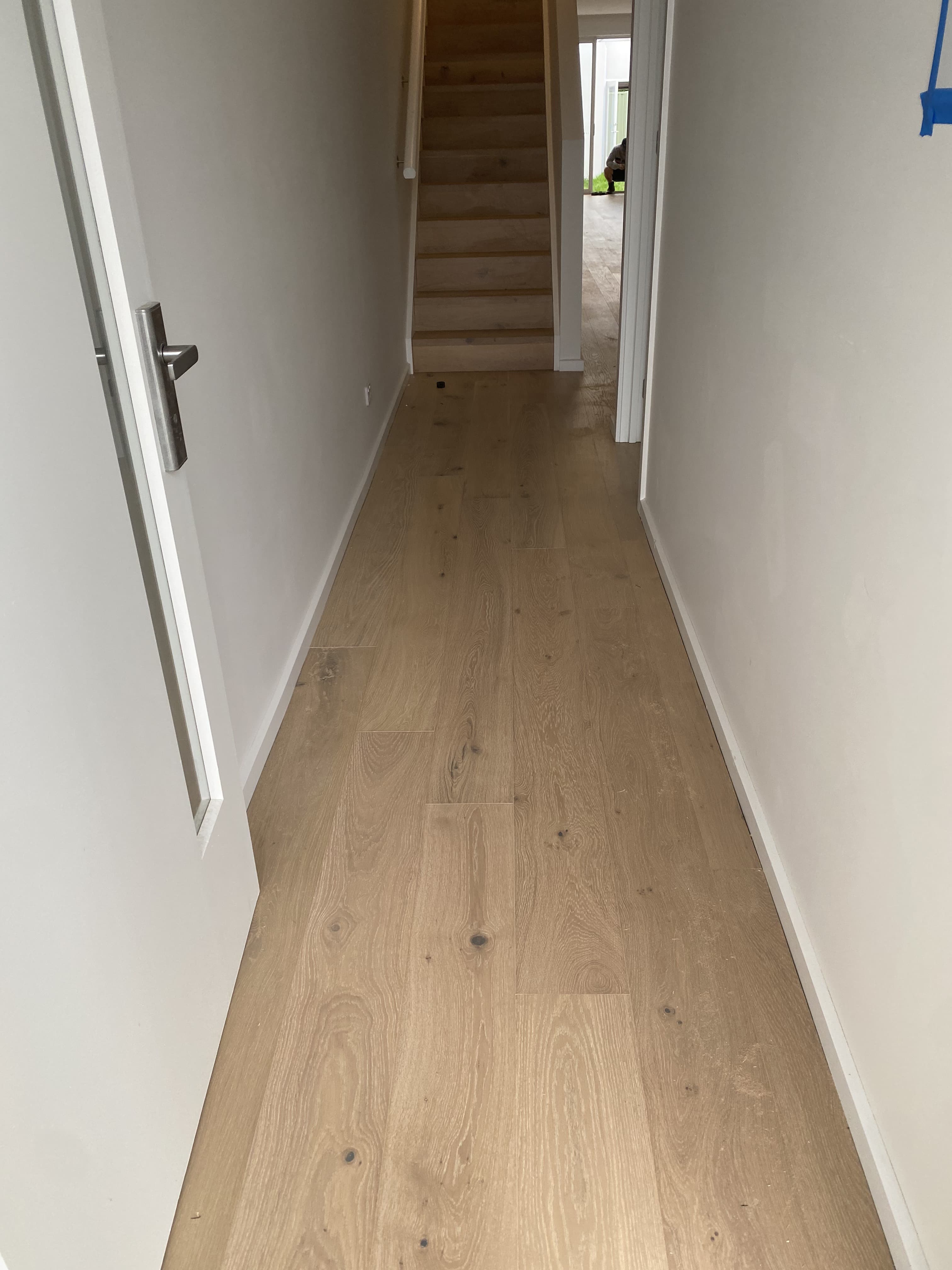 Natural European oak hybrid flooring hallway leading to stairs Melbourne