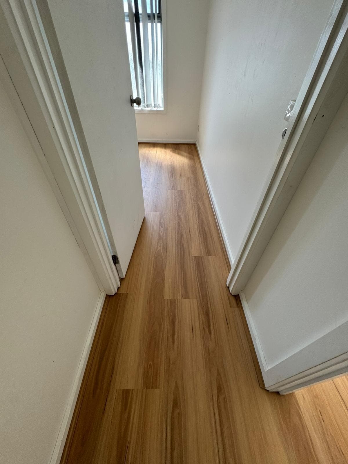 Warm golden oak hybrid flooring hallway Melbourne renovation